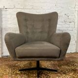 Swivel armchair in velvet fabric and metal
