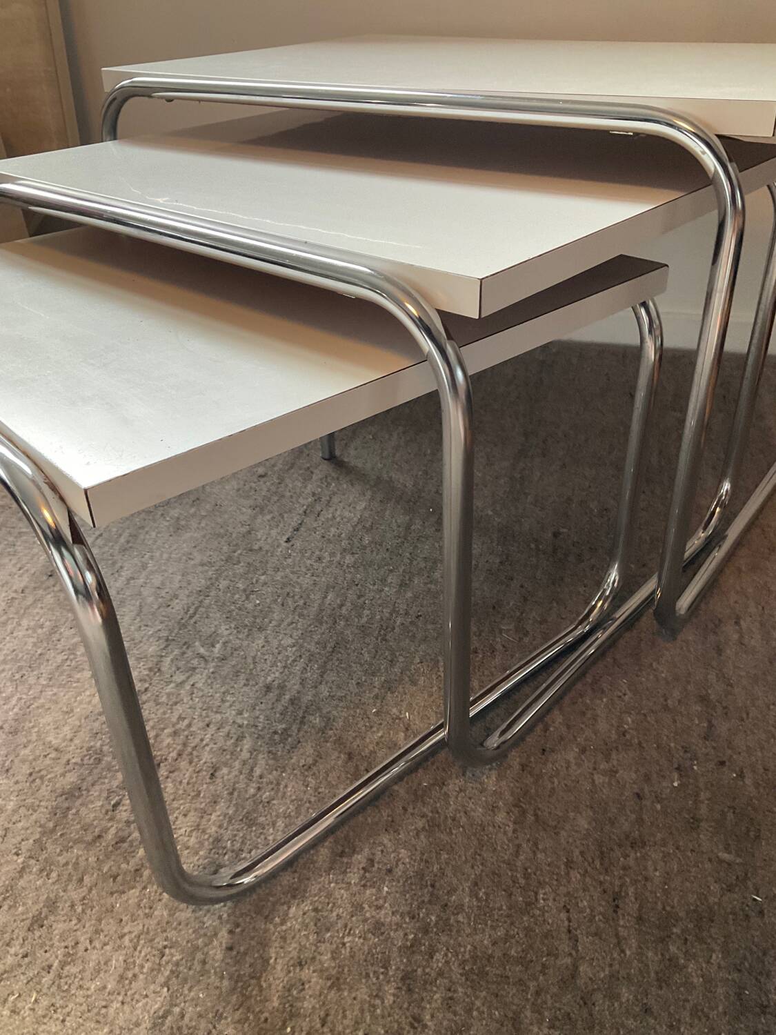 Trio of vintage nesting tables in Formica and chrome metal