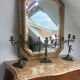 Set of 3 antique three-branch candelabras with cherubs and bronze patina.