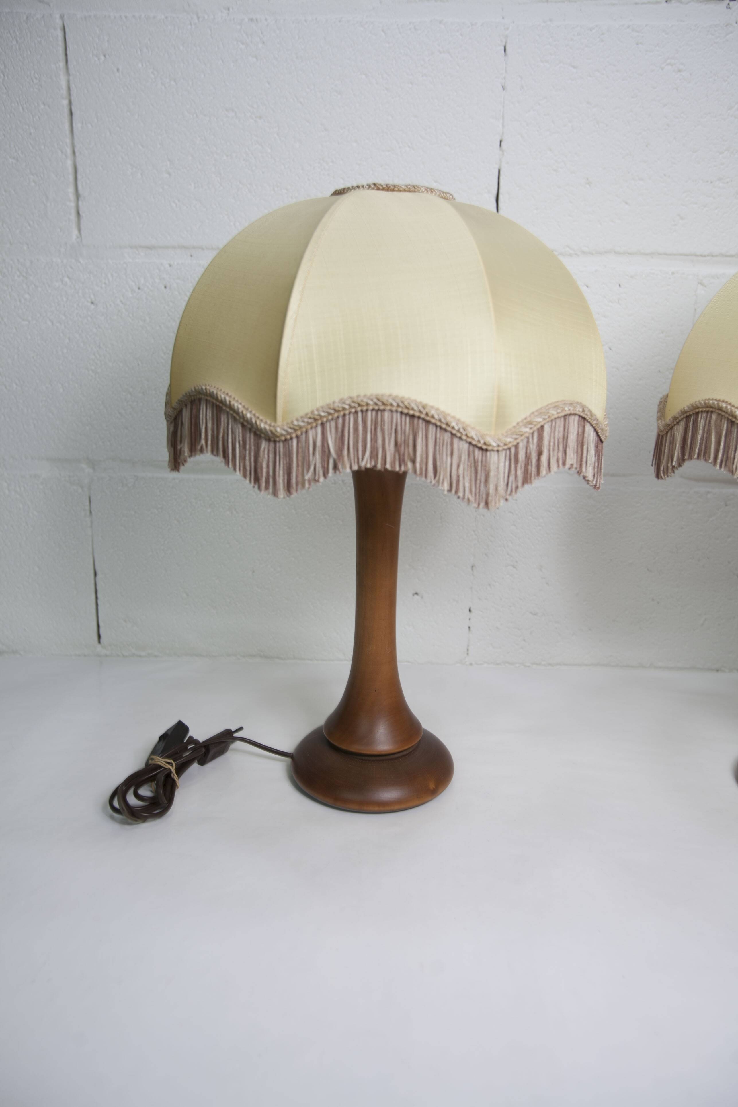 Pair of 1930s Art Deco bedside lamps with fringes, solid wood legs 52cm