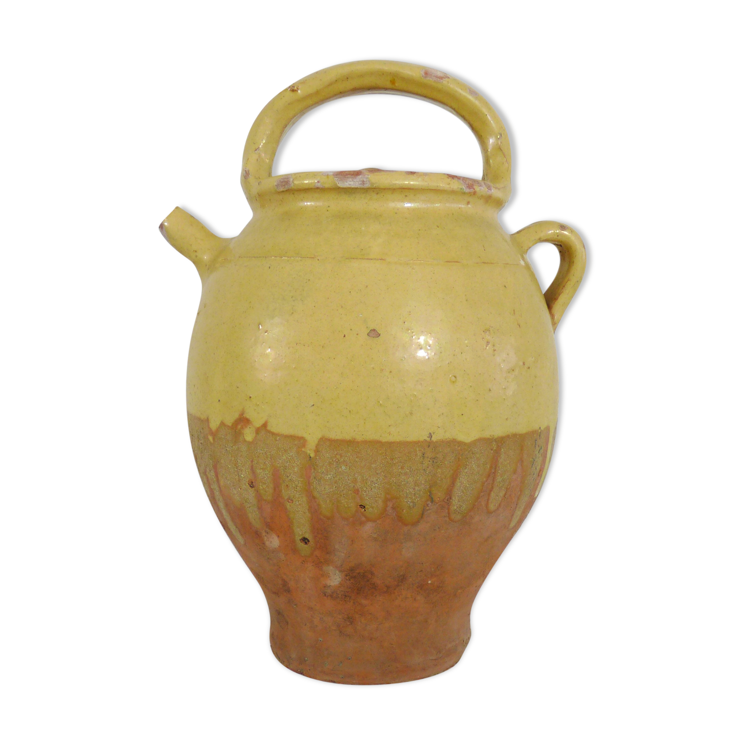 Old jug, chevrette, water pitcher in glazed yellow sandstone. Early twentieth century