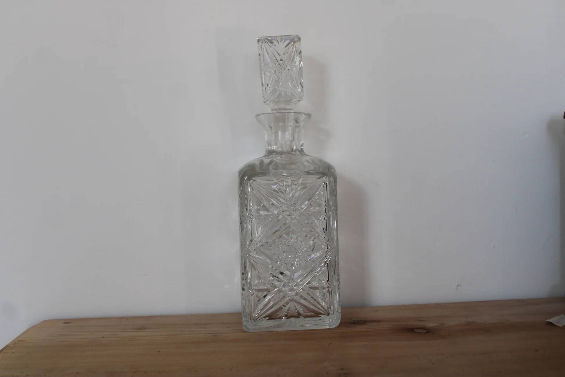 Antique cut glass carafe, probably crystal – Geometric patterns and matching stopper.