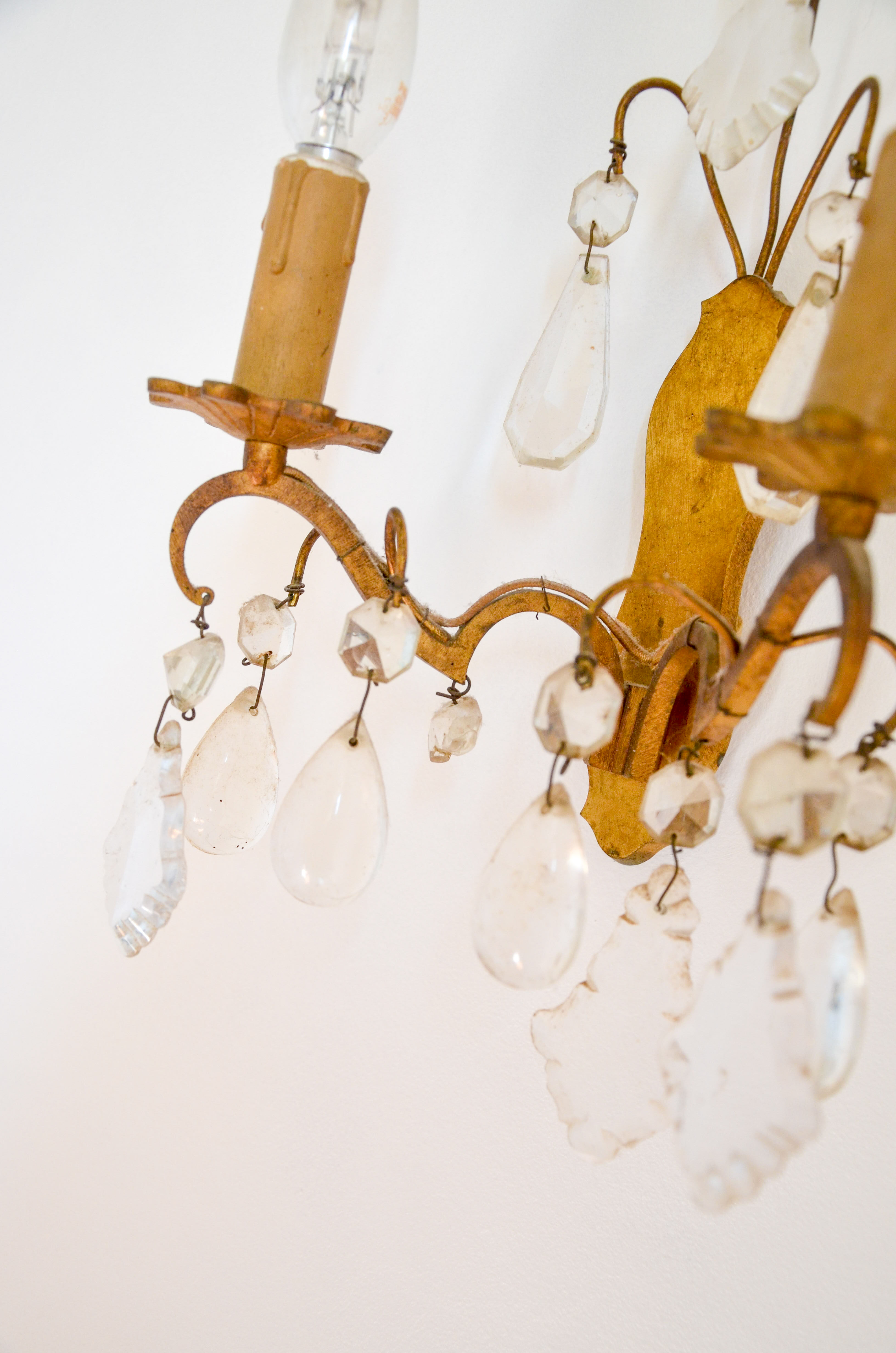 Pair of golden sconces with tassels