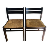 Pair of straw-seated wooden chairs in the regain style.