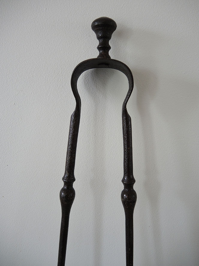 Old wrought iron fireplace clamp