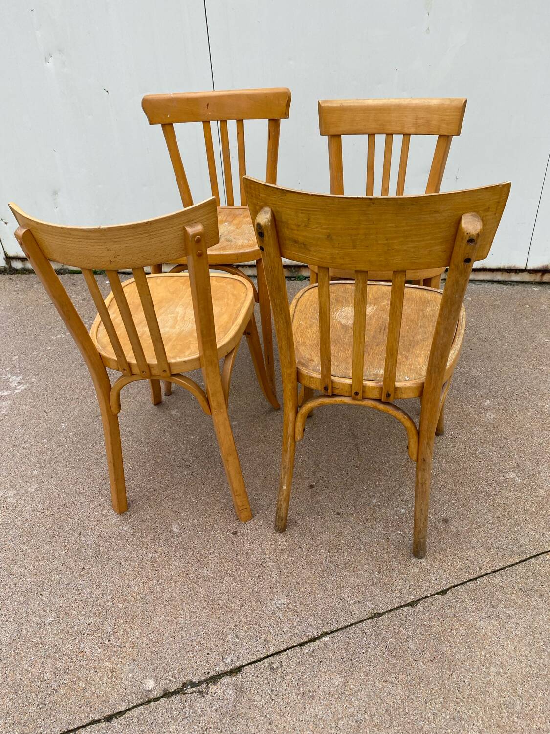 Curved varnished bistro chairs