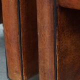 Vintage set of 4 sheepskin leather dining chairs on castors