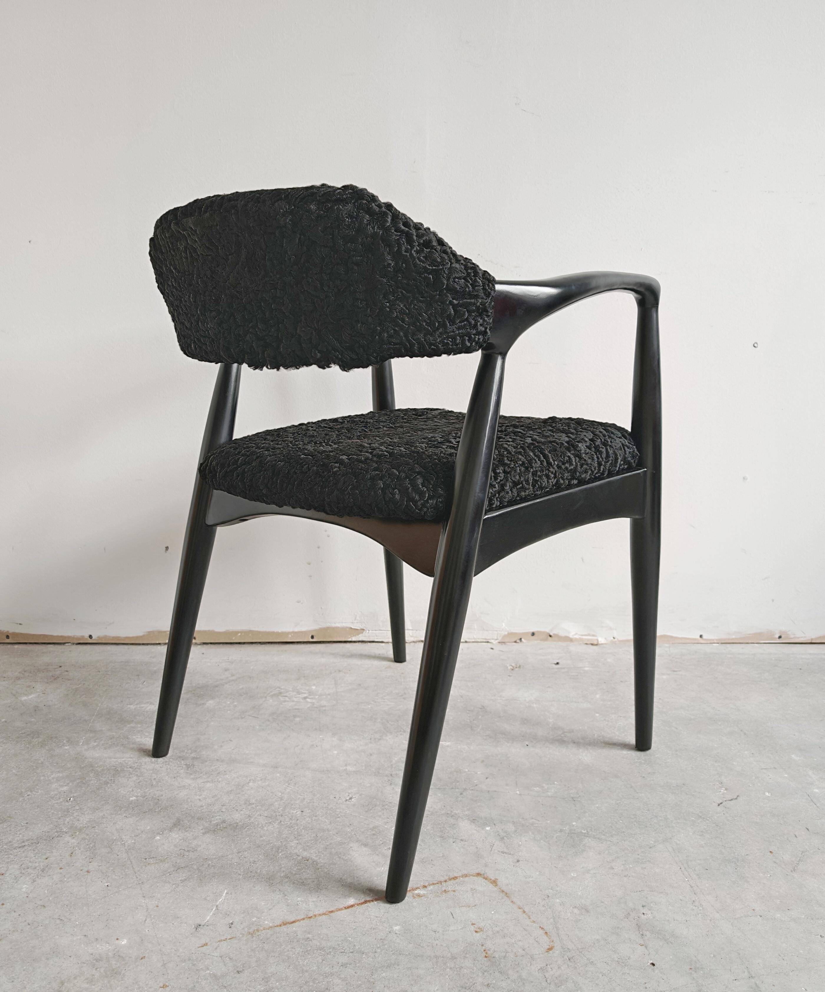 Pair of Mid Century Modern armchairs in astrakhan leather.
