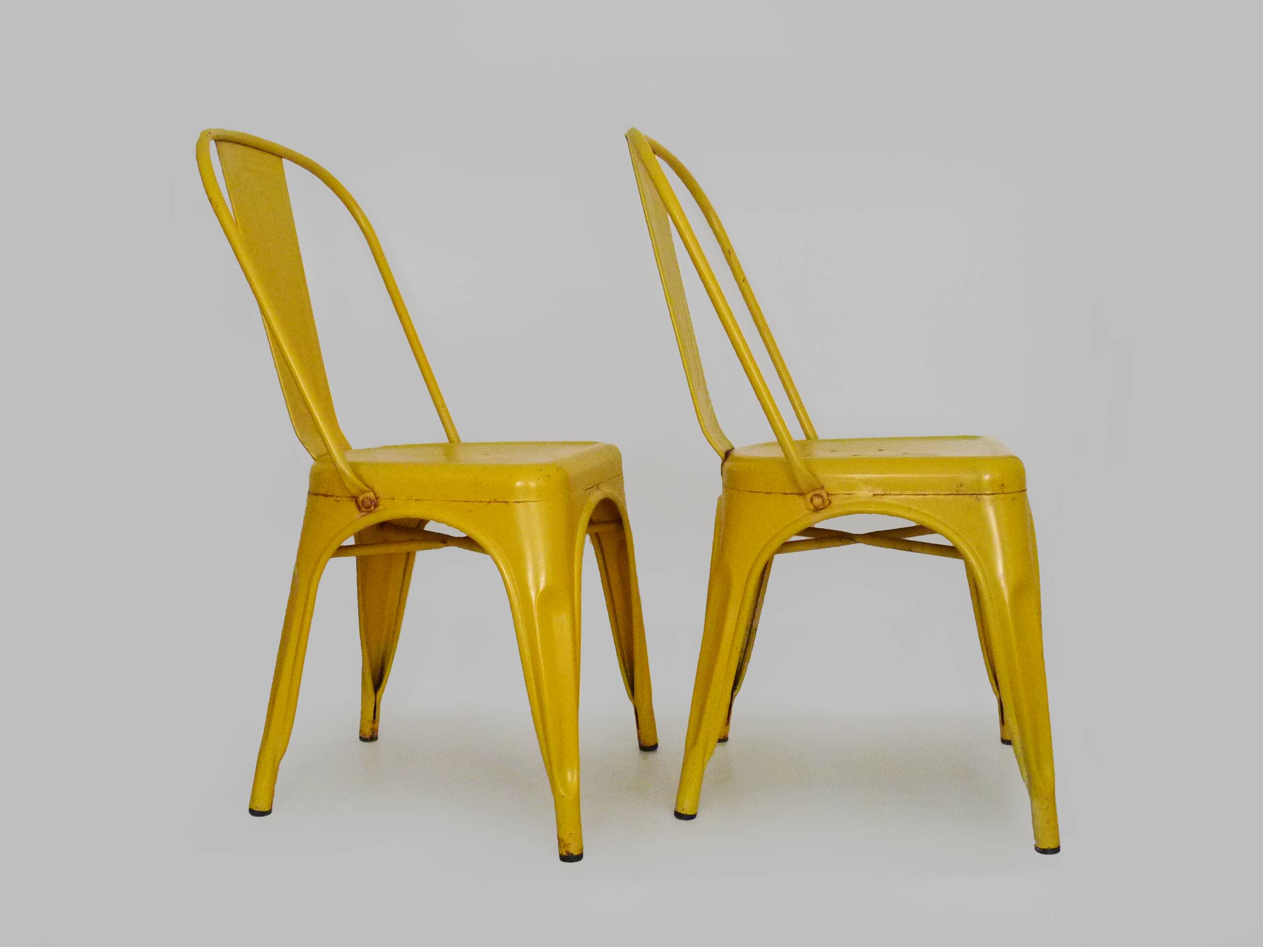 Pair of Tolix Chairs in yellow metal by Xavier Pauchard