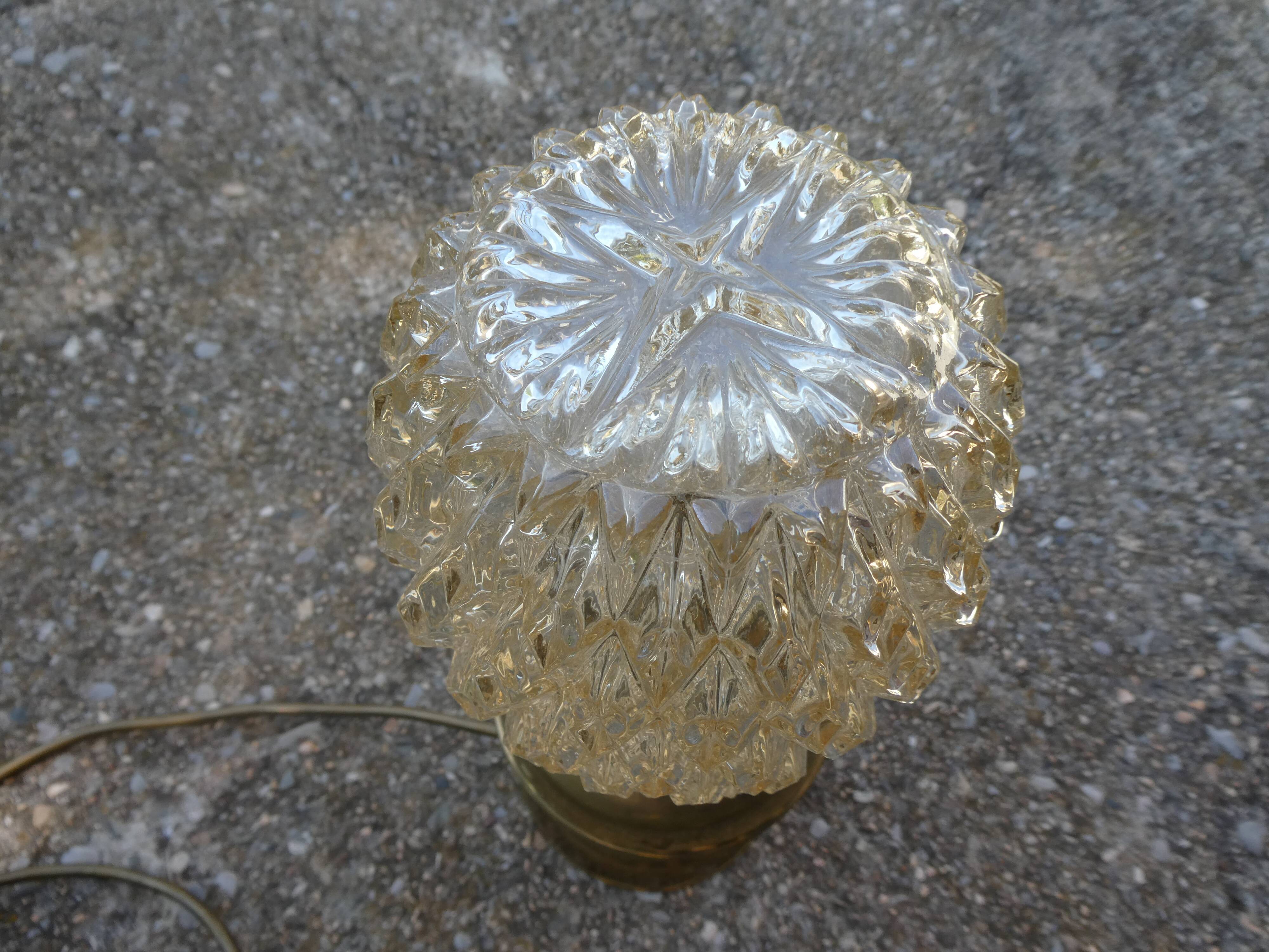 Vintage table lamp with chiseled glass globe.