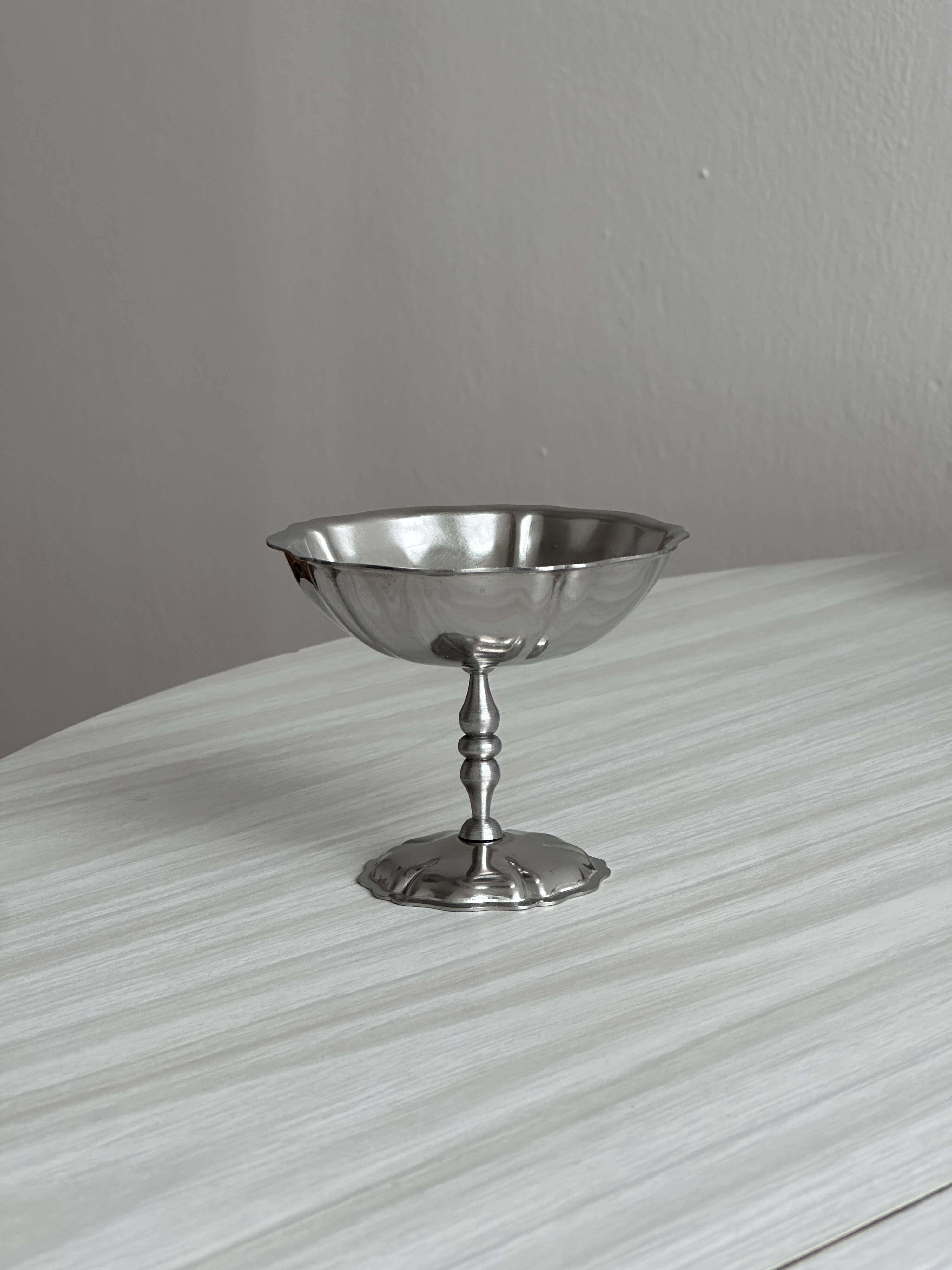 10 footed bowls in stainless steel in the style of Letang Remy