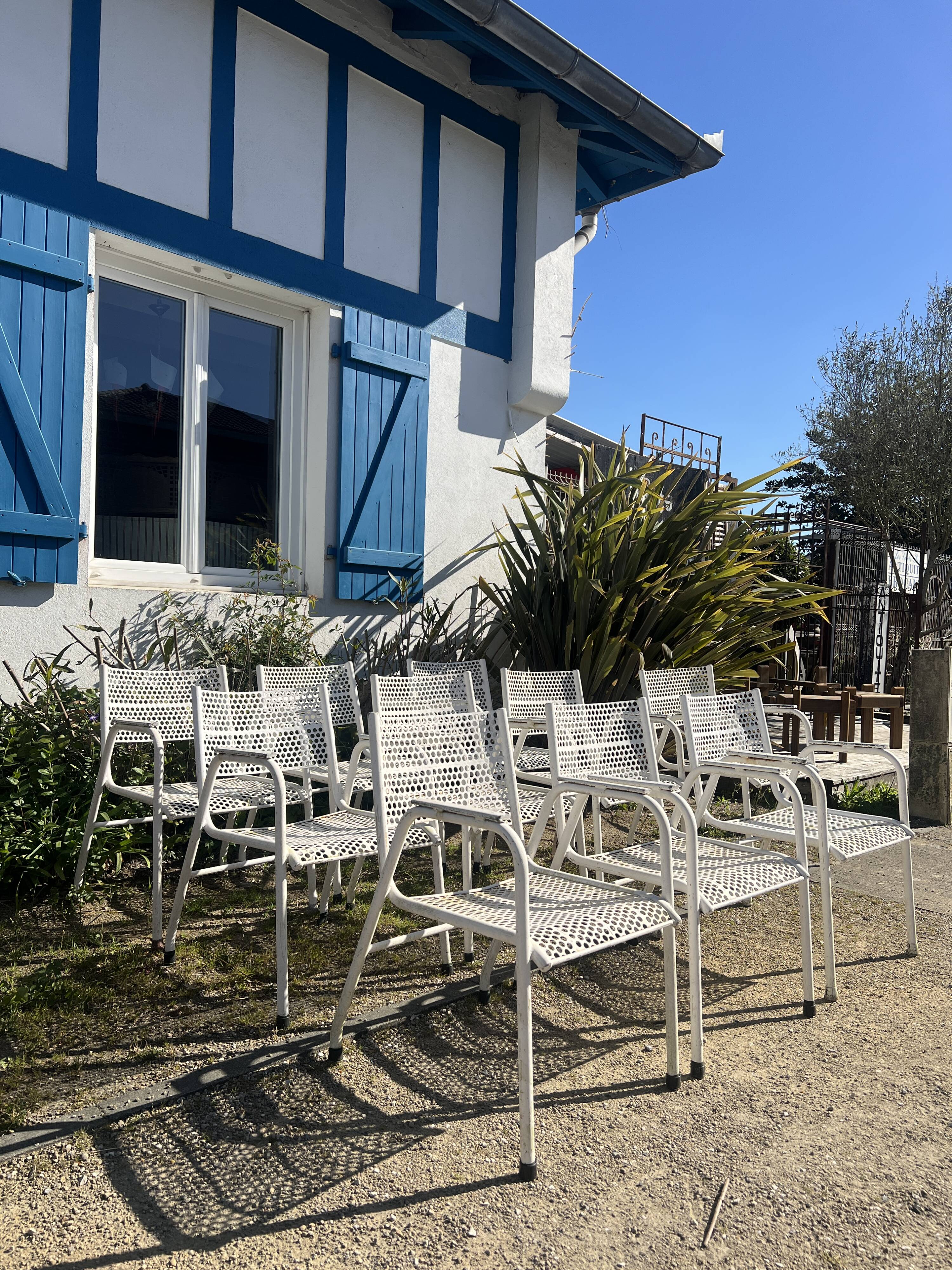 Set of 10 perforated metal garden chairs