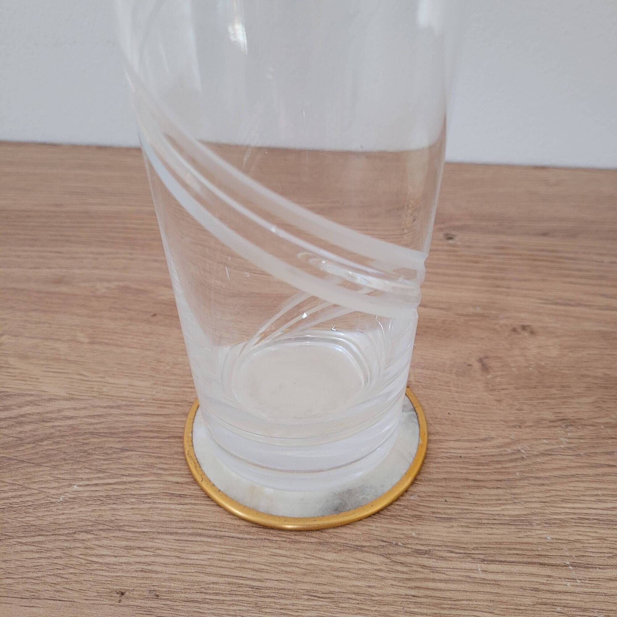 Set of 11 mother-of-pearl coasters with brass rim.