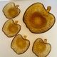Amber glass dessert service in the shape of an apple made in Italy.