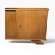 Vintage wooden display cabinet with green glass.