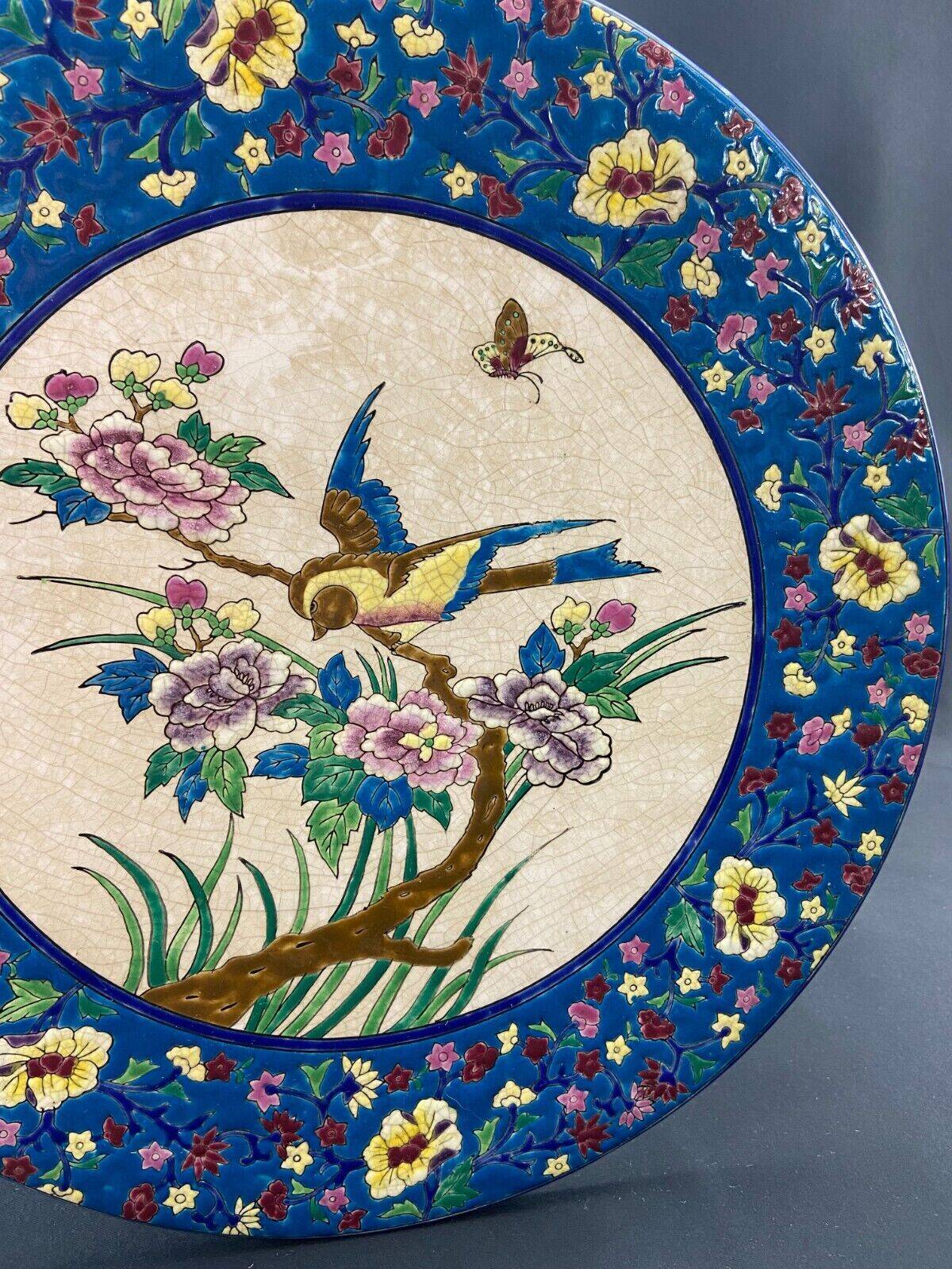 Large circular earthenware dish from Louvière with Longwy style bird decoration