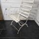 Old wrought iron and wood garden armchair