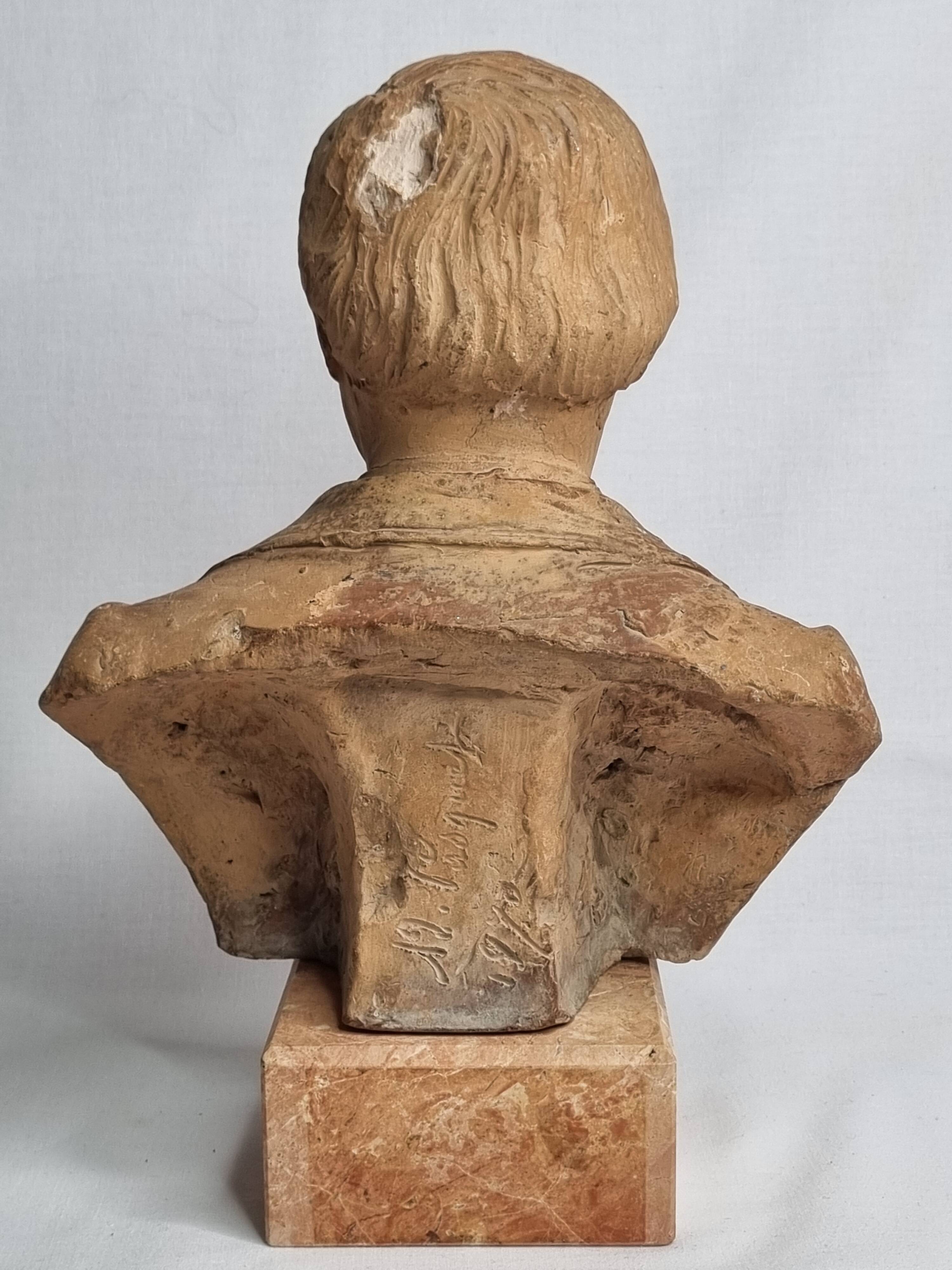 Bust of a notable in terracotta, 29 cm, signed Pasquet, 1870, on a base.
