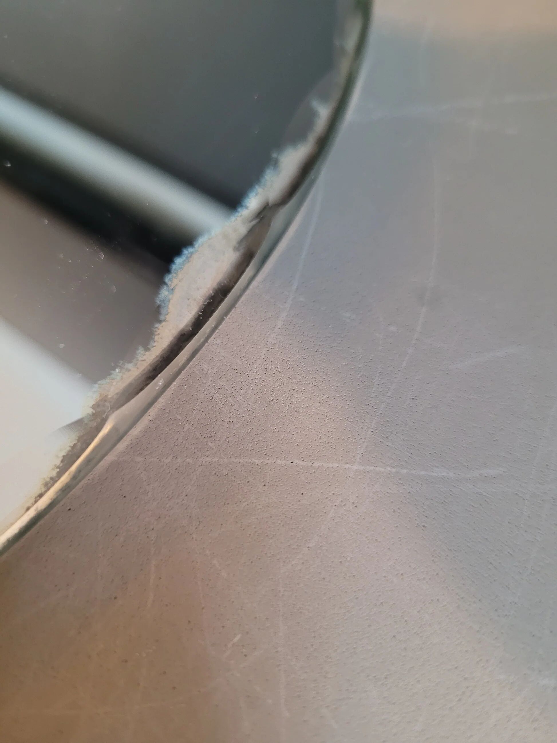 Antique oval mirror with chiseled edges