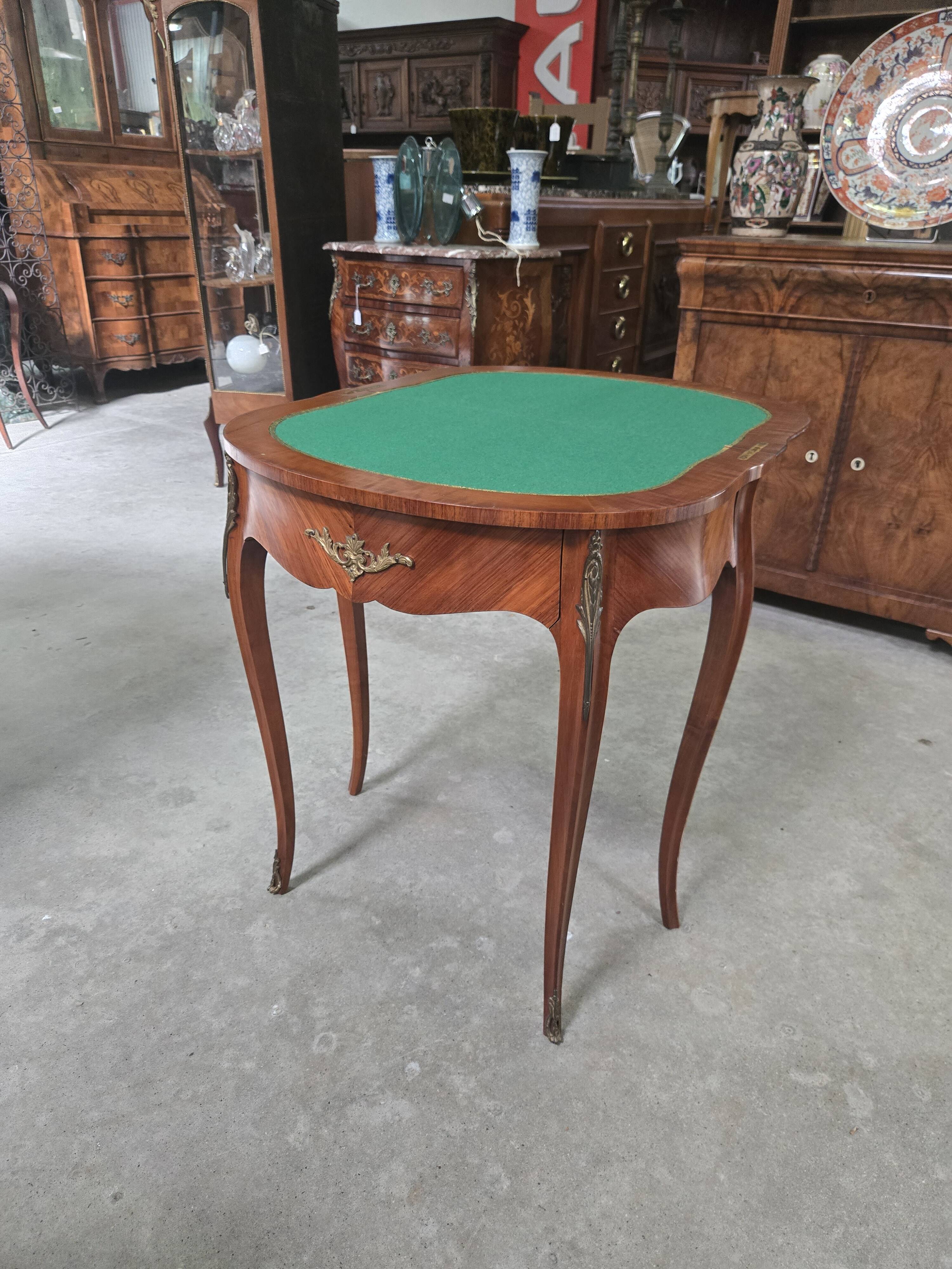 Half-moon gaming table in Louis XV style, made of precious wood marquetry.