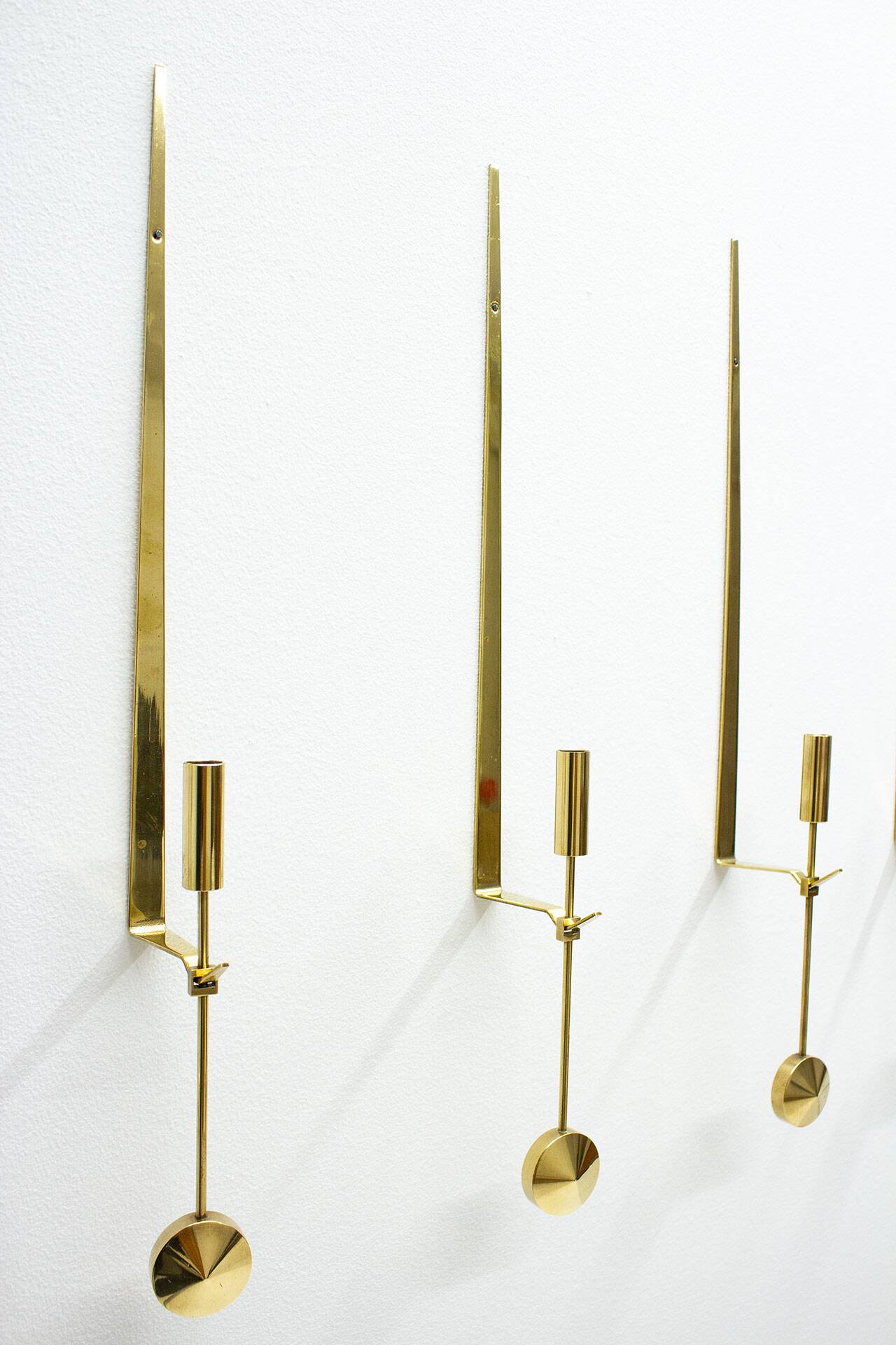 Group of 10 Swedish brass candle sconces by Pierre Forssell for Skultuna