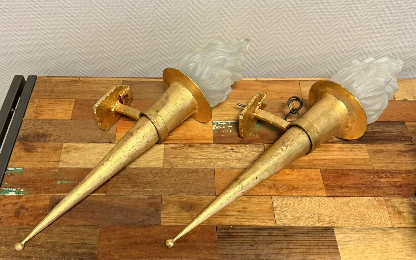 Pair of large medieval-style torchiere lamps in gilded metal
