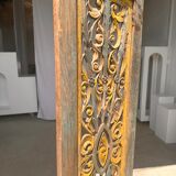 Rectangular Indonesian construction element with blue and yellow plant in carved wood