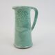 Large green ceramic pitcher with leopard enamel
