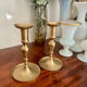 Pair of brushed brass candle holders