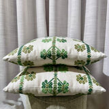 Custom cushions with green clover patterns.