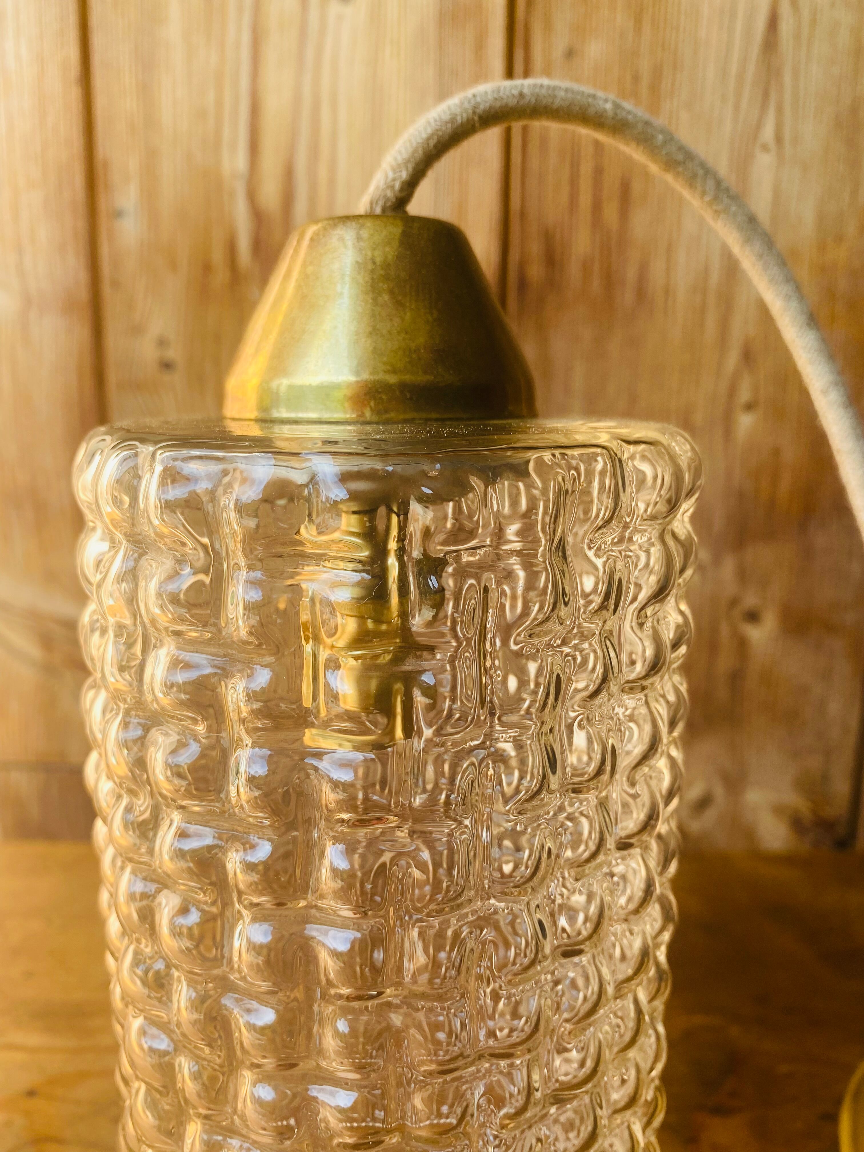 Glass and brass suspension.