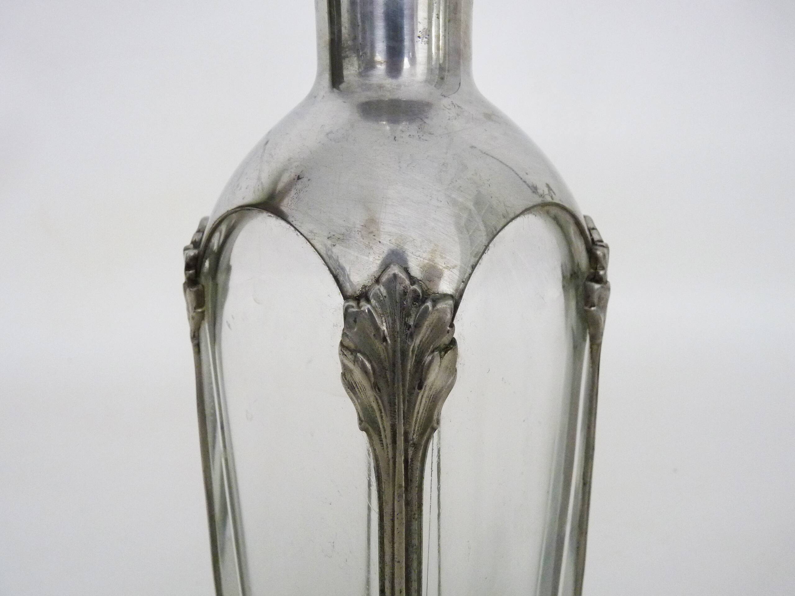 Magnificent crystal and silver-plated metal carafe bottle.