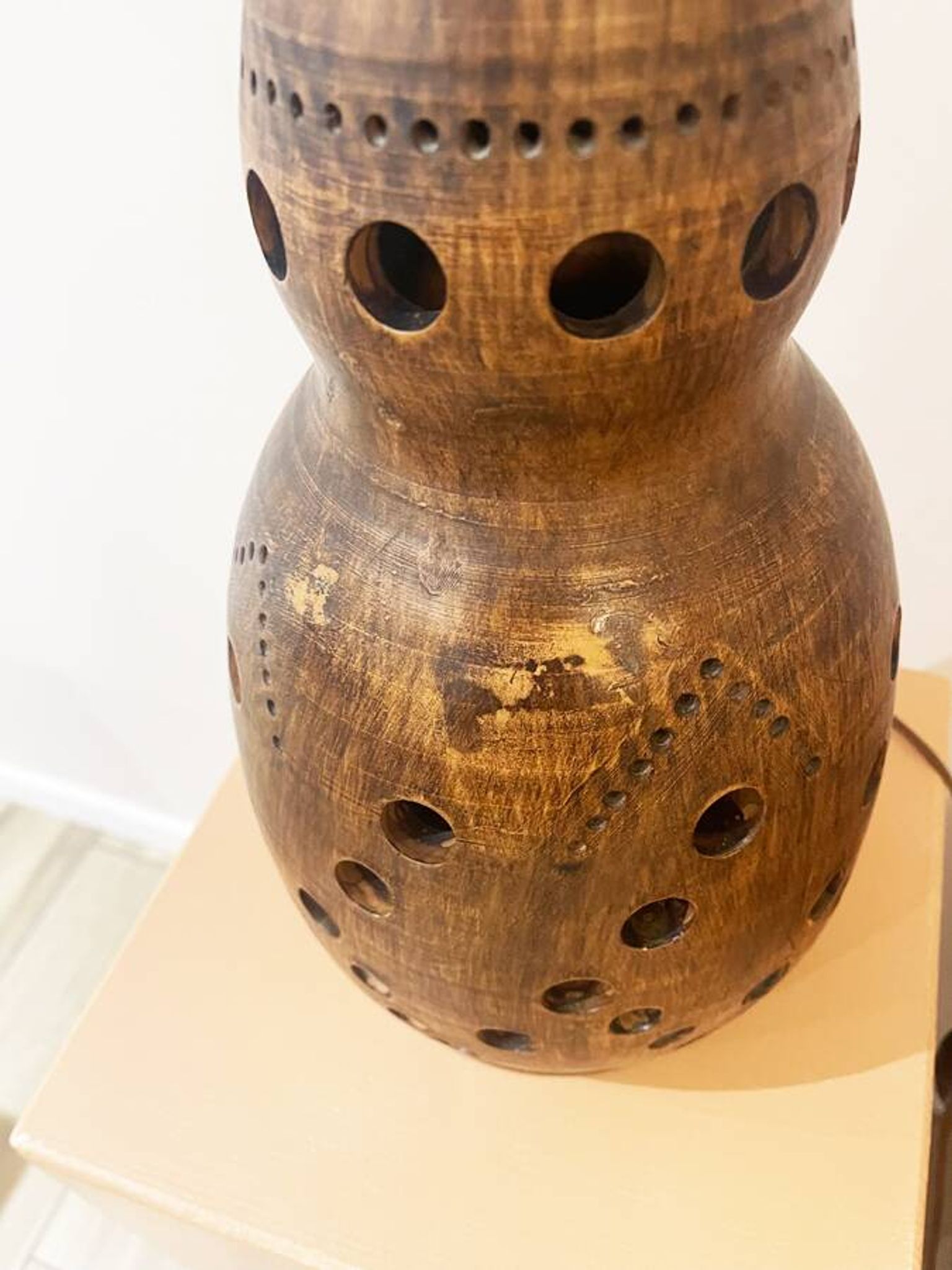 Terracotta lamp with cut-outs, circa 1970.