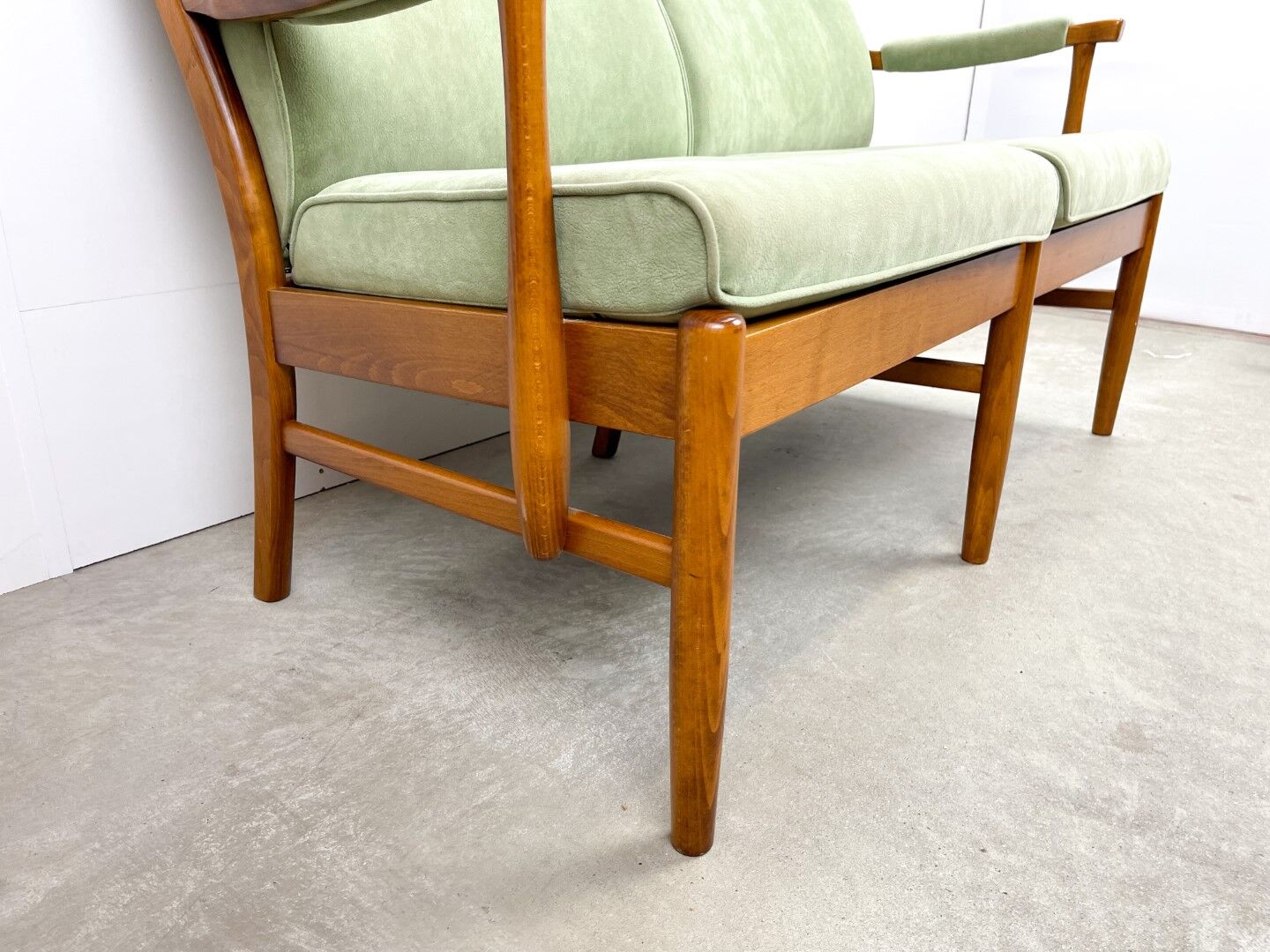Two-seater sofa from the sixties with green upholstery