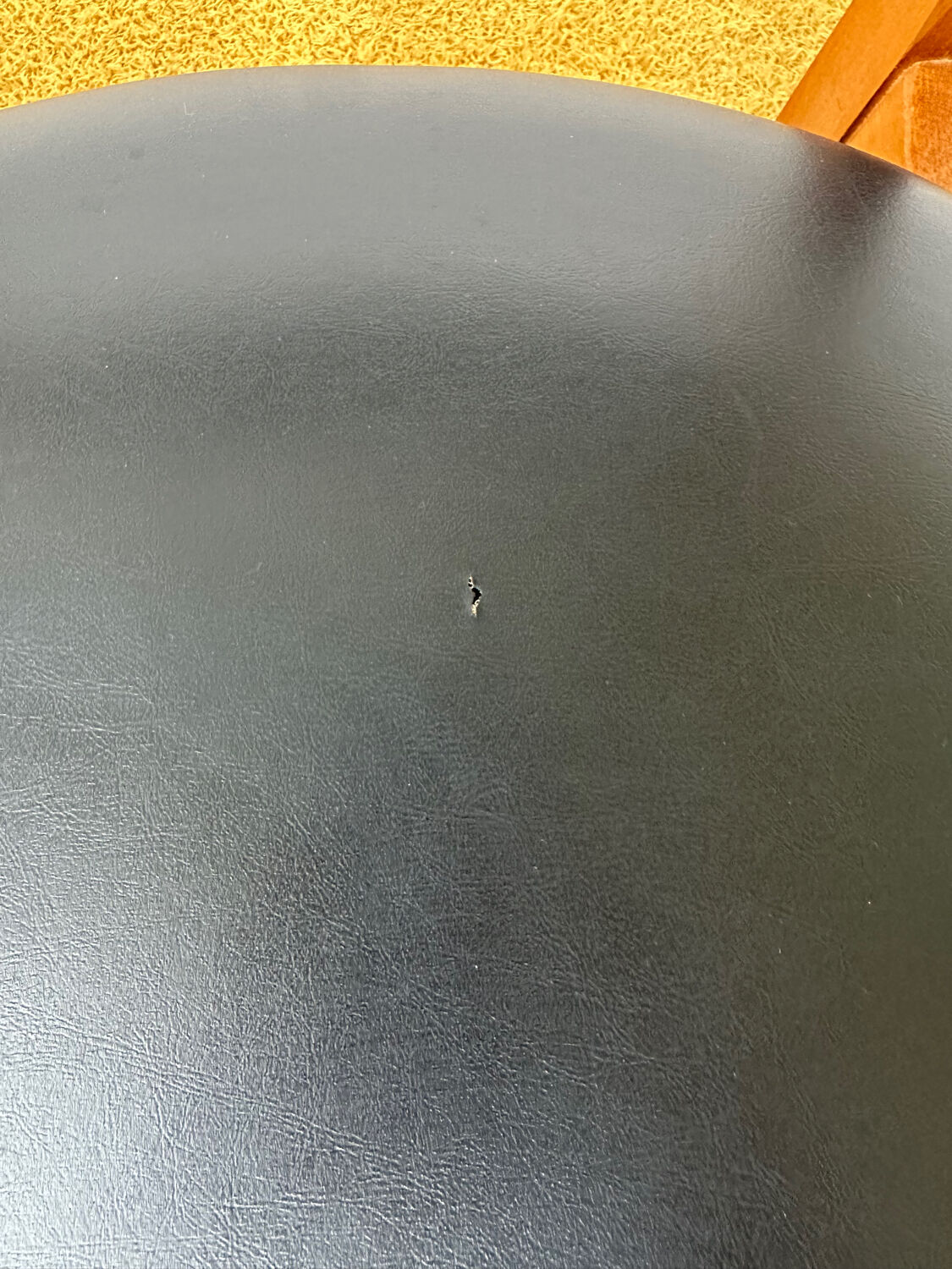 4 Scandinavian chairs in teak and black faux leather.