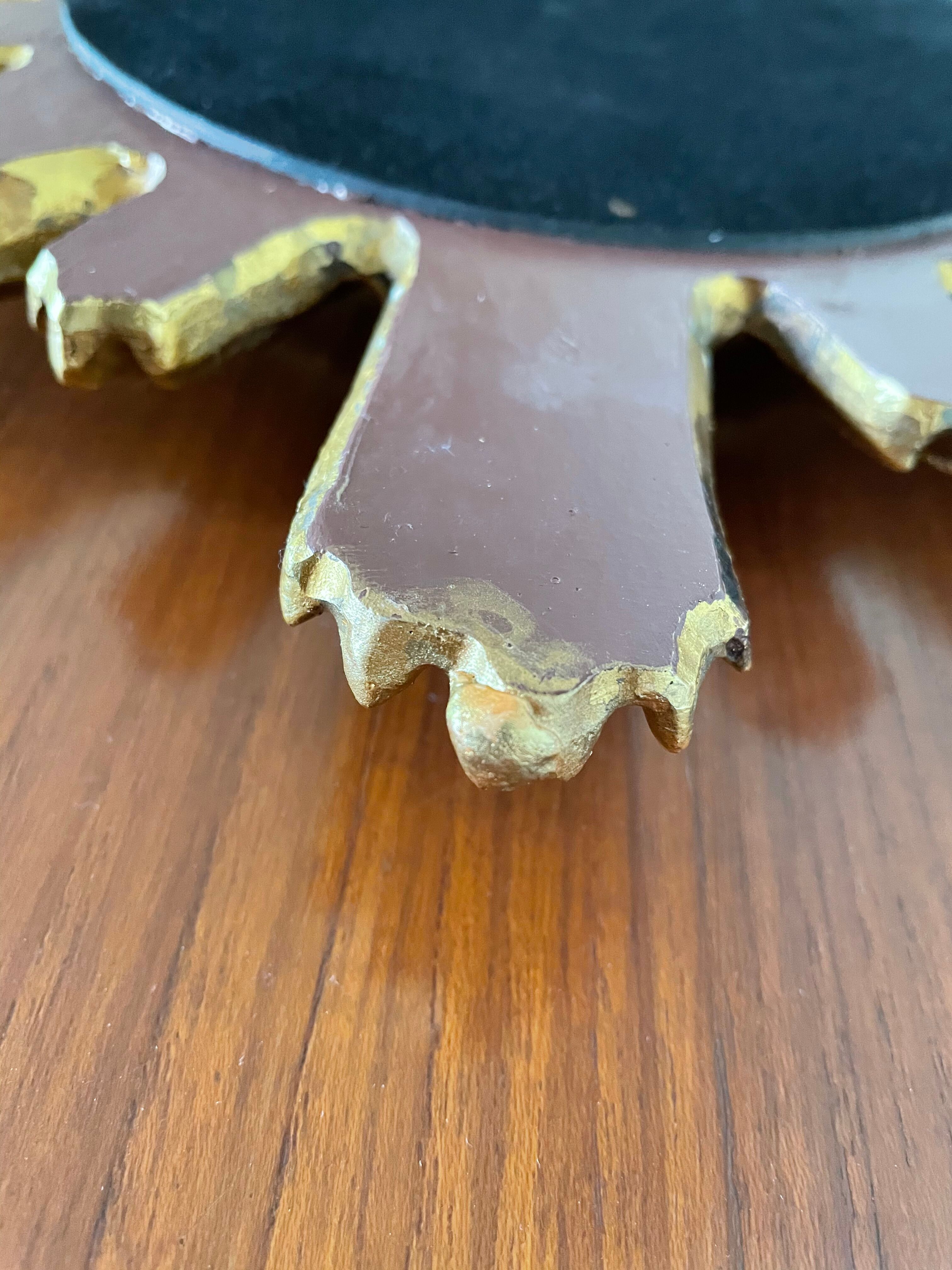 Vintage sun mirror in 60s/70s gold resin