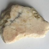 White marble ashtray with a raw appearance