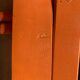 Vintage folding chair in orange painted wood