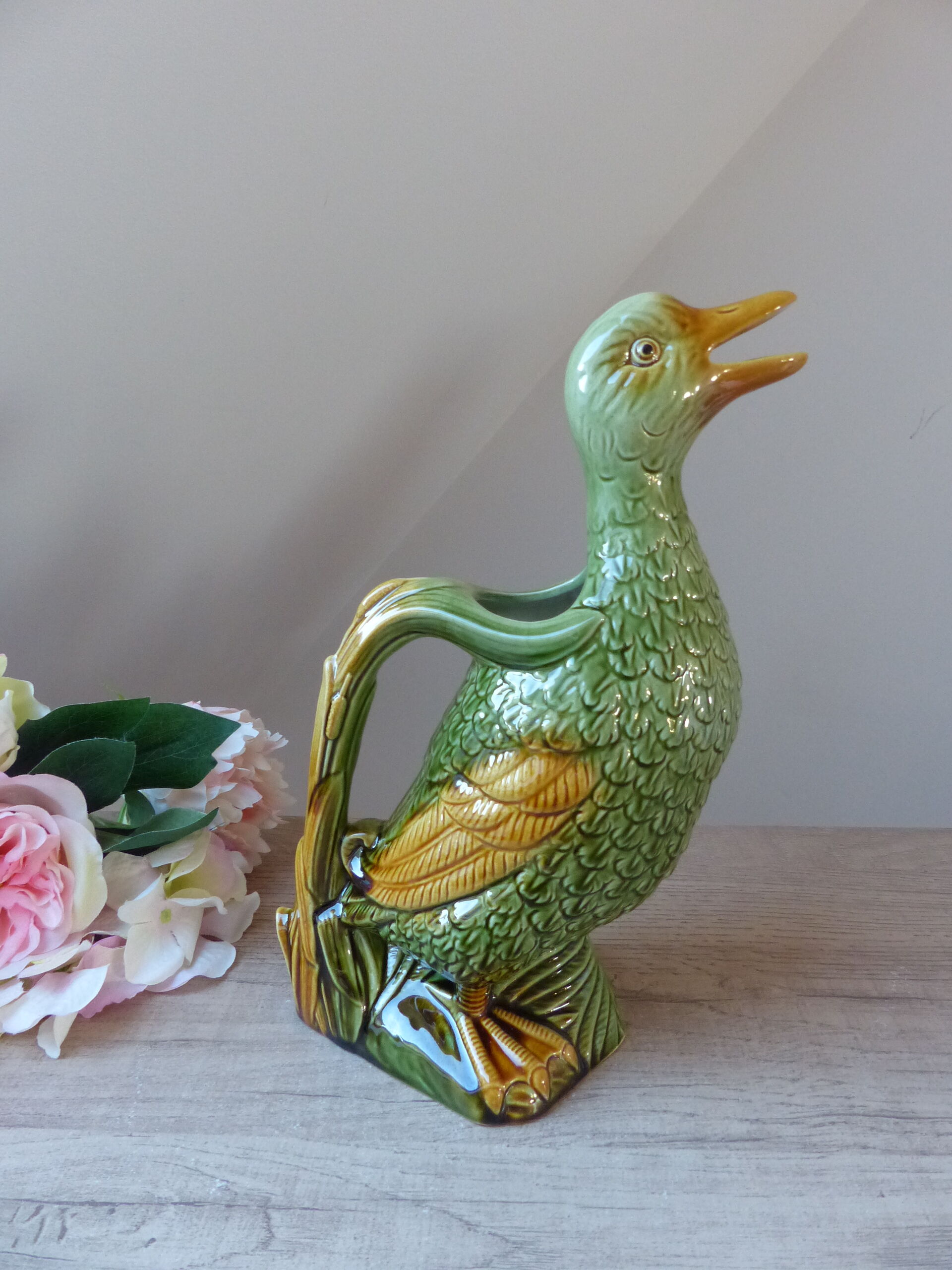 Pitcher zoomorph duck in green and yellow slip