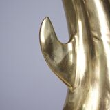 Solid brass dolphin console feet.