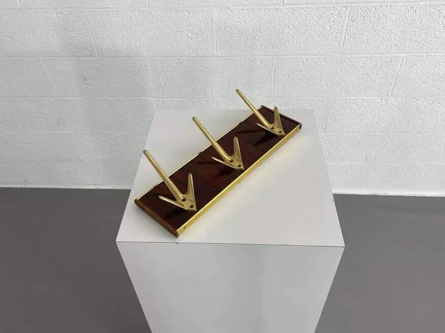 Coat rack or wall hook from the 1950s in wood and brass.