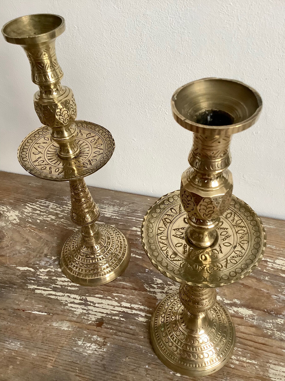 Pair of engraved brass candle holders