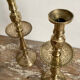 Pair of engraved brass candle holders