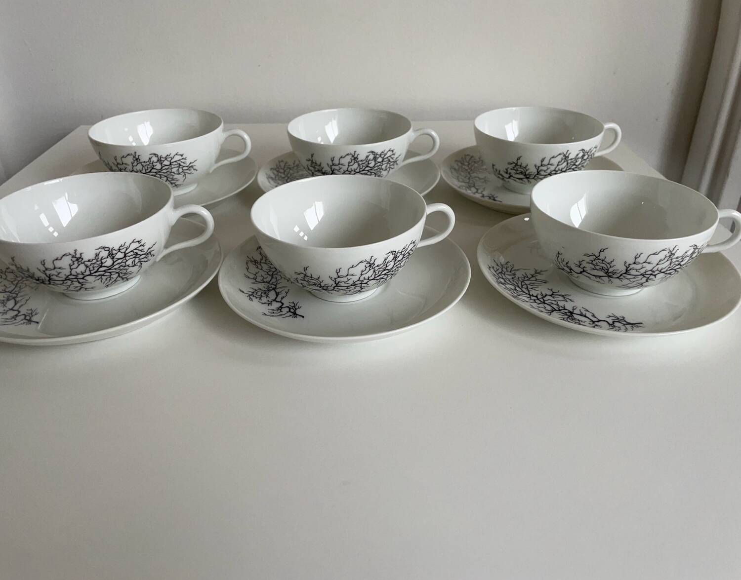 Françoise Adnet “Black Coral” 6-cup and saucer set – Pork