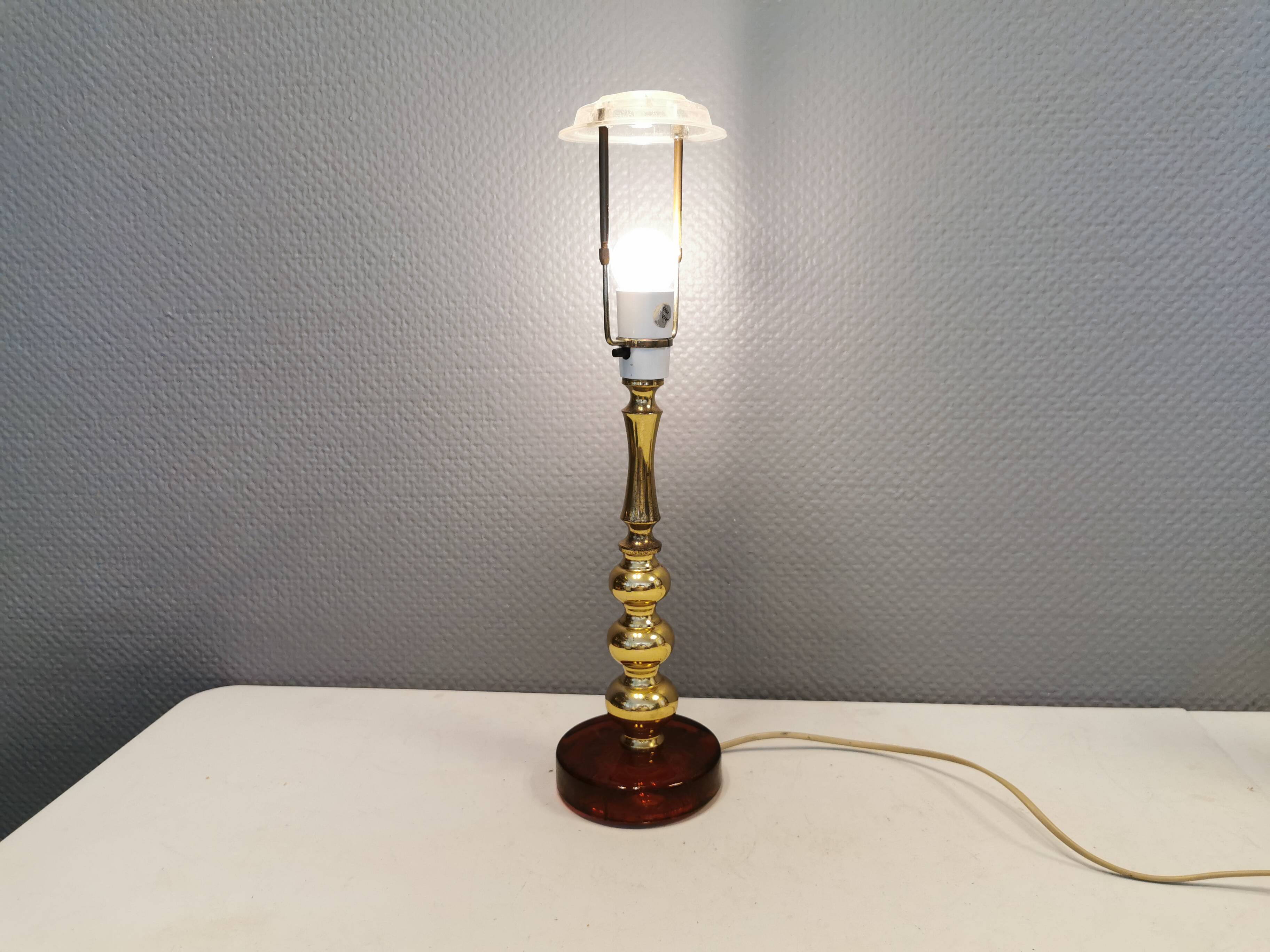 Table lamp from Danish Vitrika in brass, amber colored hard pressed glass, with a shade holder.