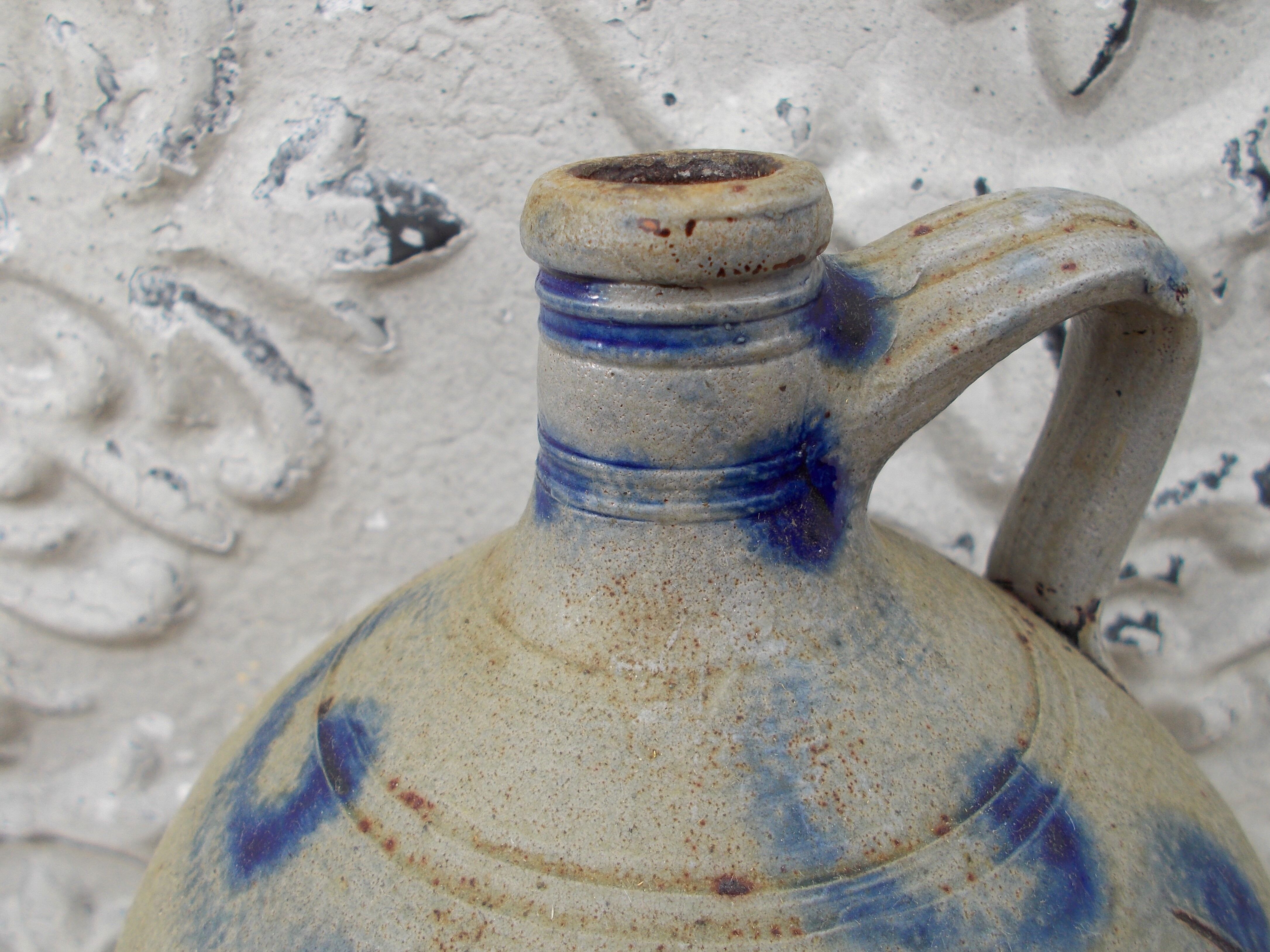 Old potiche jug in sandstone of Alsace