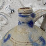 Old potiche jug in sandstone of Alsace