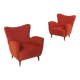 Une paire de fauteuils rouges avec des pieds en forme de cône, années 1950.