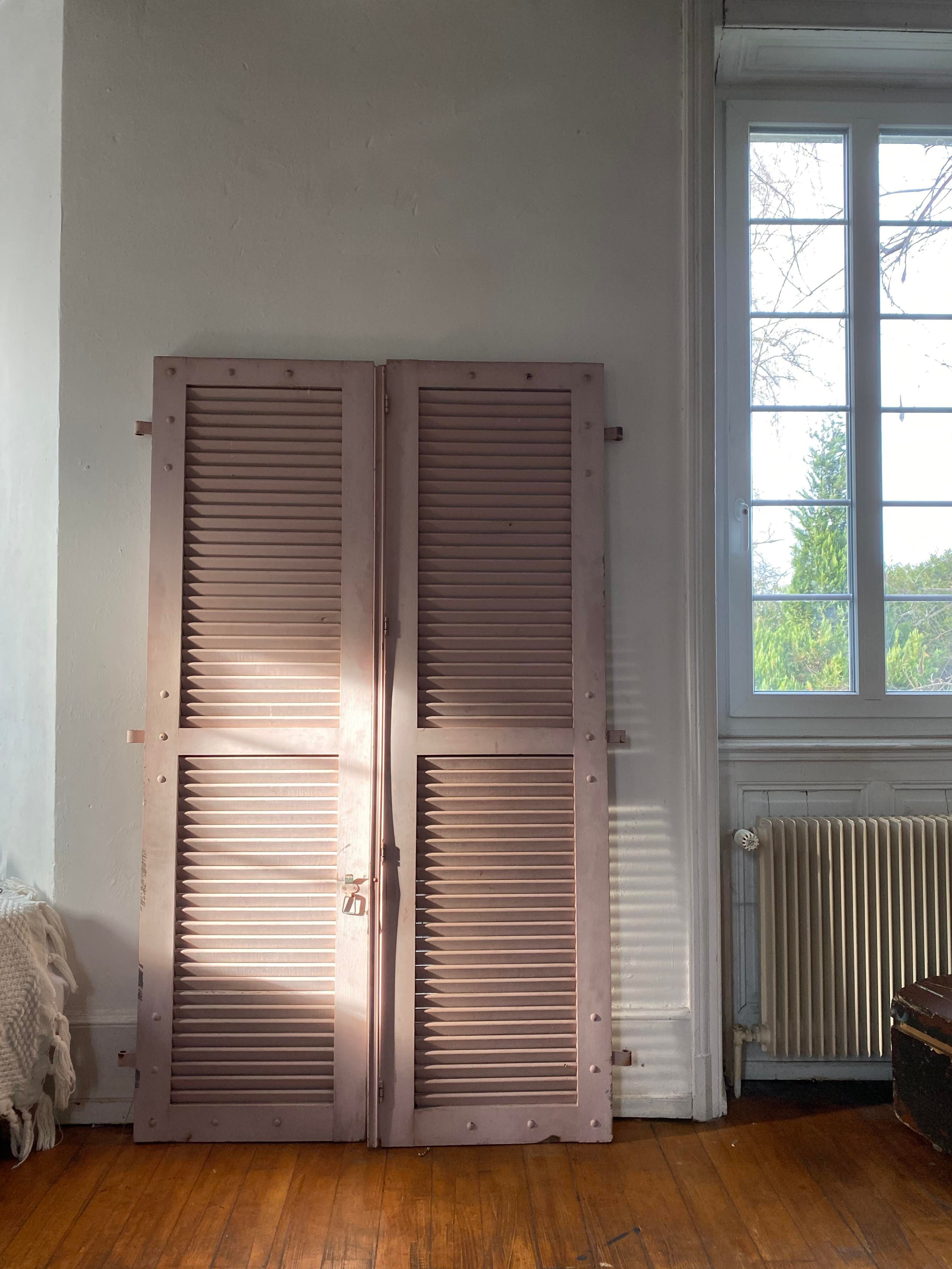 Pair of shutters with wooden shutters in old pink color