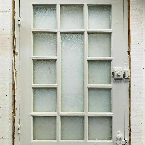 Porte de service à petits carreaux et imposte vitrée XX siècle